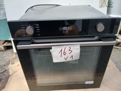 a black oven that has a price tag on it