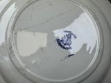 a white plate with a blue and white design on it