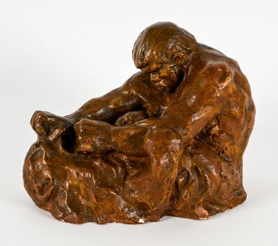 statue en bronze représentant un homme assis sur un rocher avec un chien