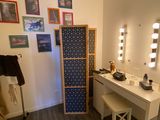 a bathroom with a vanity and a mirror in it