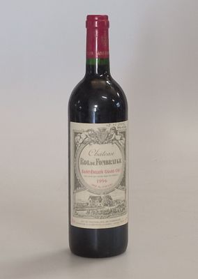 a bottle of wine that is sitting on a table