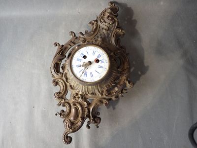 a clock that is hanging on the wall in the room