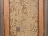 an old picture frame with a drawing of a man on it