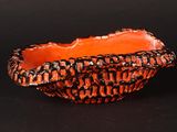 a small bowl that is sitting on a black surface
