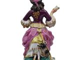 an image of a figurine of a woman with a dog