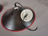 two lamps sitting on a table with wires attached to them