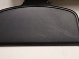 a close up of a black object on a white surface