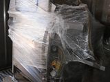 a machine that is sitting on a pallet in a room