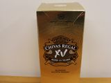 bottles of chivas regal xv on a table in a room