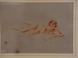 painting of a nude woman laying on her stomach on the ground