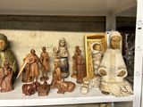 many figurines that are on a shelf together