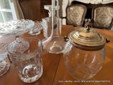 a table that has a lot of glass items on it