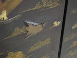 a close up of a cabinet with a bird on it