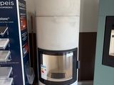a white stove sitting next to a black and white box