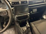 a dashboard of a car with a steering control in it