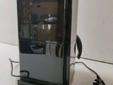 an image of a small black refrigerator on a white surface