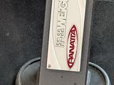 a luggage bag with a sticker on it sitting on the floor