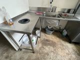 a kitchen with a stainless steel sink and a dishwasher