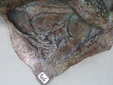 a bronze sculpture of a horse with a number on it ' s face