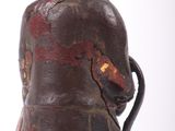 a vase that has a red and black design on it