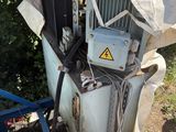 an old air conditioner sitting on the side of the road
