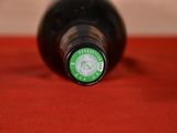 a close up of a bottle of wine on a table