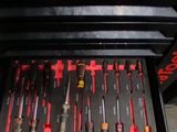 a lot of tools in the drawer of a toolbox