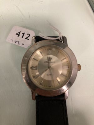 a watch that is sitting on a table with a price tag attached to it