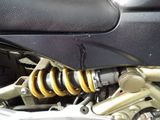 a close up of a motorcycle with a shock absorbr on it