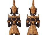 pair of black and gold statues of a man and a woman