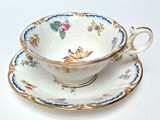 a tea cup and saucer on a saucer