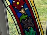 a stained glass window with a flower design on it