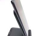 a cell phone that is sitting on top of a stand