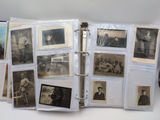 a binder with a bunch of old photos on it