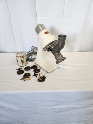 a microscope on a table with a cup of coffee and a pair of sunglasses