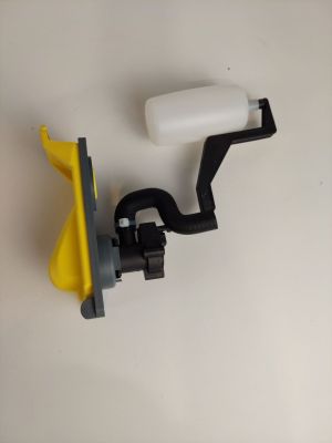 un objet jaune et noir sur une surface blanche