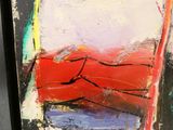 abstract painting of a red boat on a body of water in a black frame
