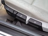 a close up of a car door handle with buttons