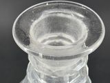 a clear glass vase that is sitting on a table