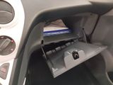 the interior of a car with a cd player in the center of it