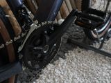 a close up of a bicycle with a chain attached to it