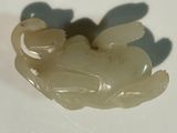 a picture of a white jade figurine of a frog