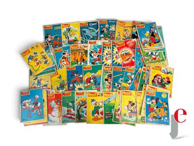 a pile of mickey mouse books on a white background