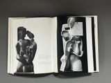 a black and white photo of a book with a picture of a woman