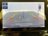 the rear view mirror of a car with a camera attached to it