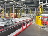 a machine that is working on a conveyor belt in a factory
