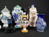 many different vases that are sitting on a table