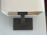 a lamp that is sitting on a table in a room