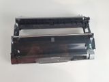 a close up of a black and white printer unit on a white surface