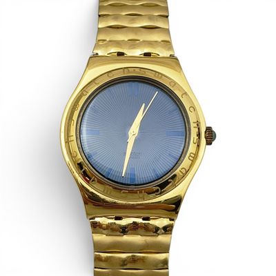 an image of a gold watch with a blue face on a white background